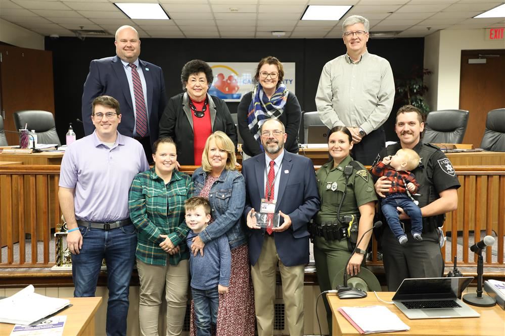  Kim Cooper and family picture with board members