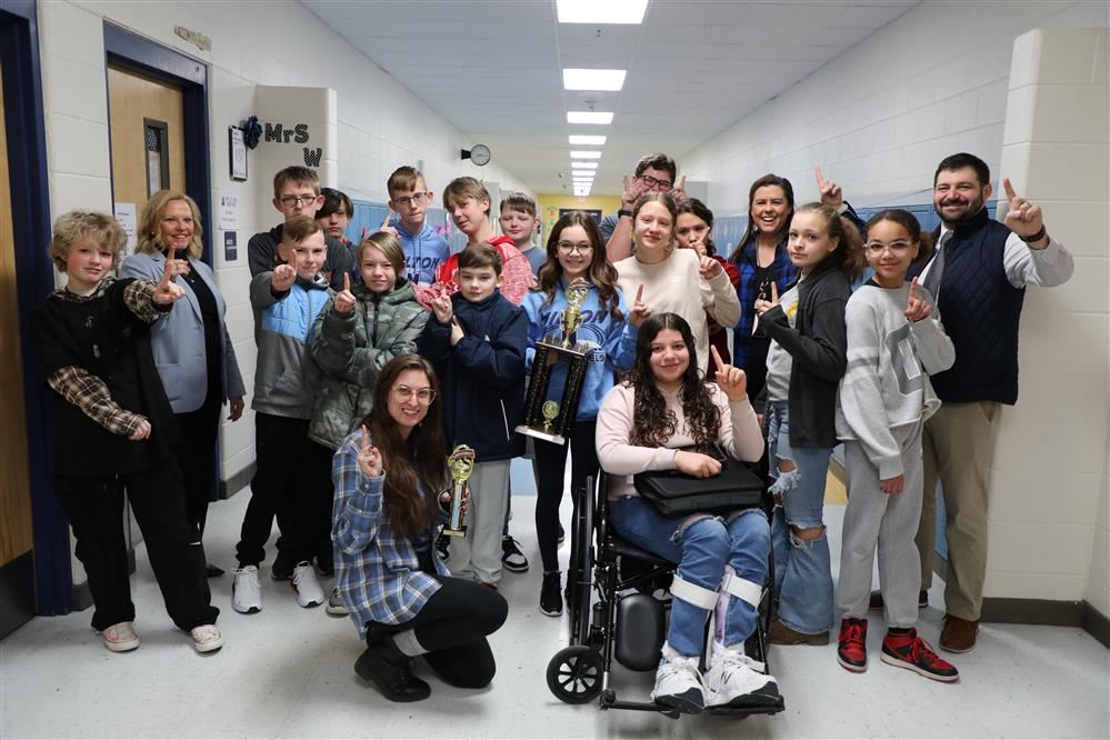  Cassandra Hall and students picture with trophy